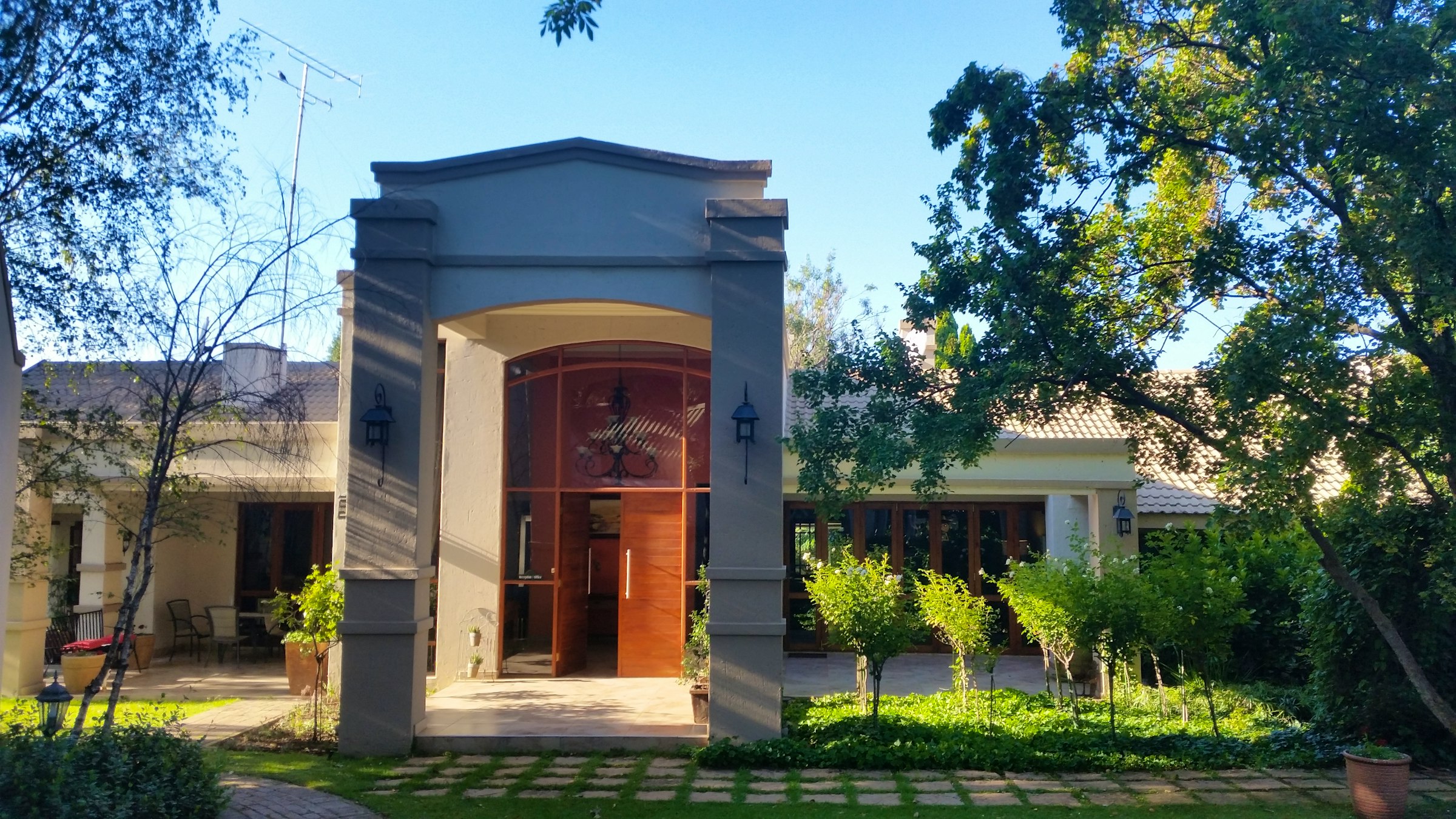 Exterior entrance and garden at Amadeus Guesthouse